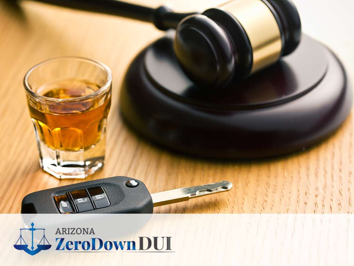 Glass of alcohol, car keys, and gavel symbolizing legal consequences for vehicles with DUI citations